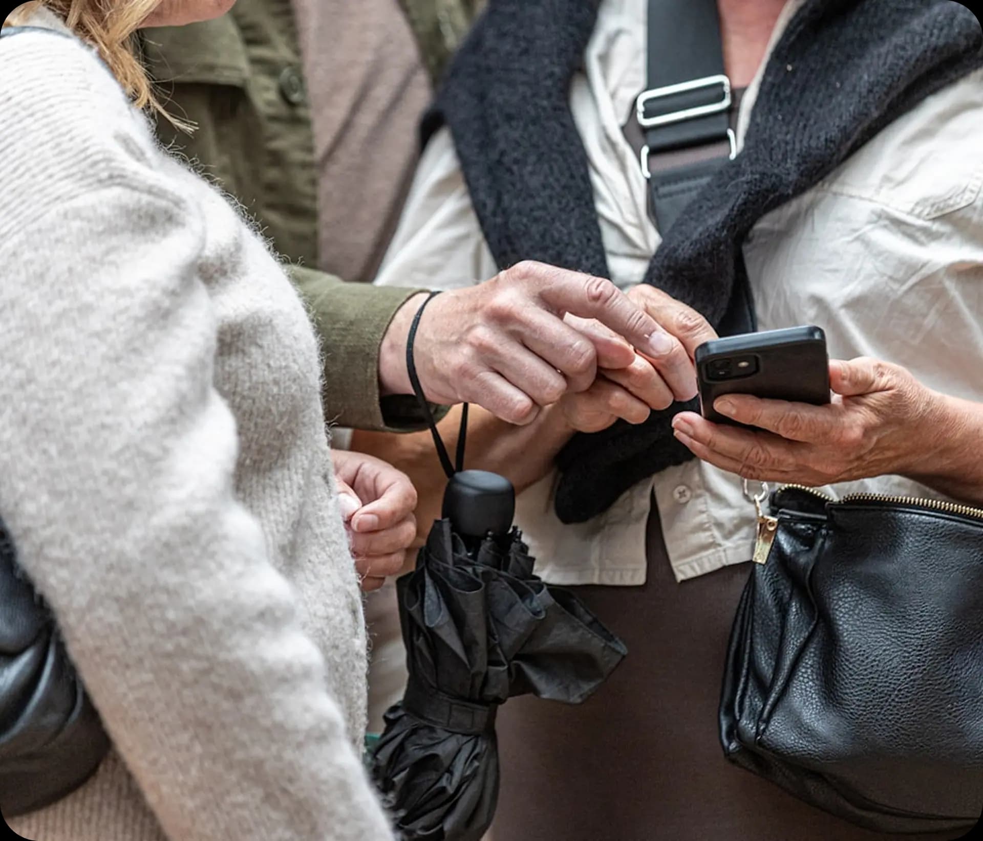 Travel professionals reviewing plans on a phone
